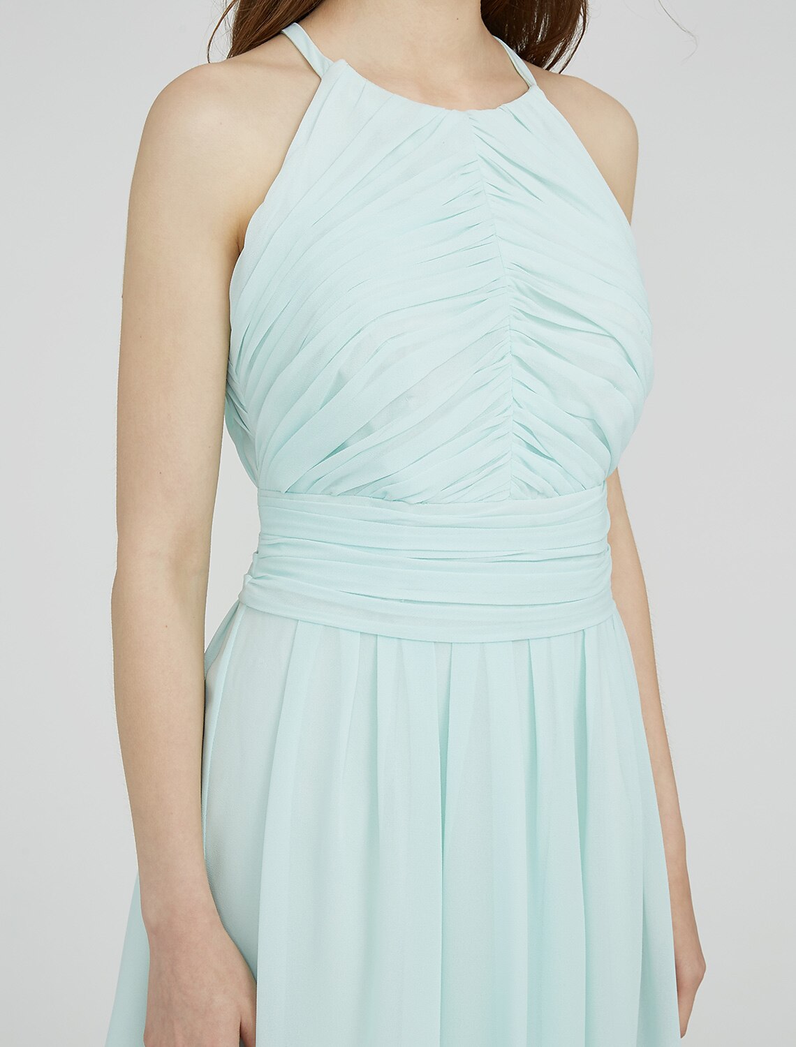 Model wearing an elegant knee-length chiffon bridesmaid dress.