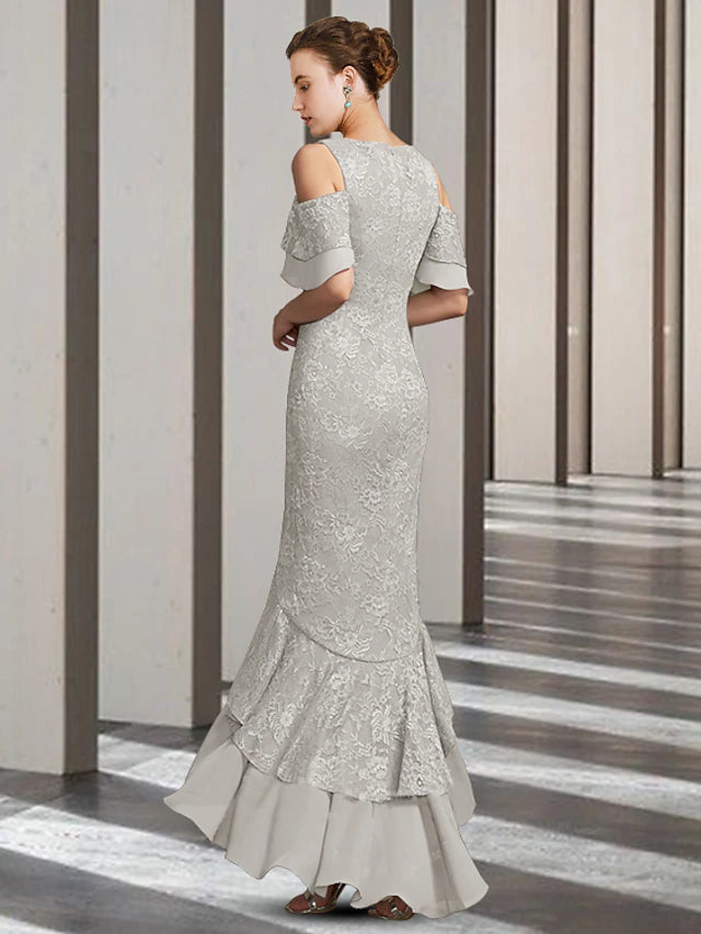 Back view of elegant sheath Mother of the Bride dress, showcasing ruffled details.