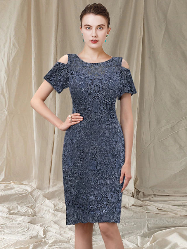 Elegant sheath mother of the bride dress with jewel neck, short sleeves, and lace appliques.