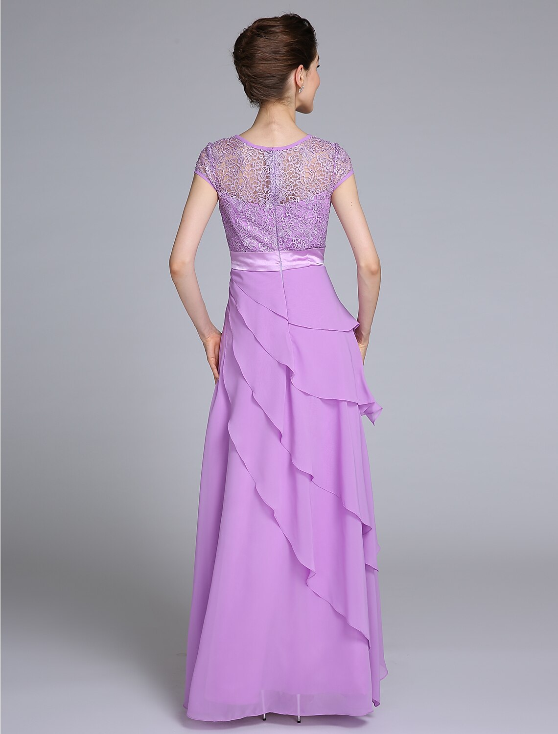 Back view of the navy blue sheath Mother of the Bride dress, showcasing lace details.