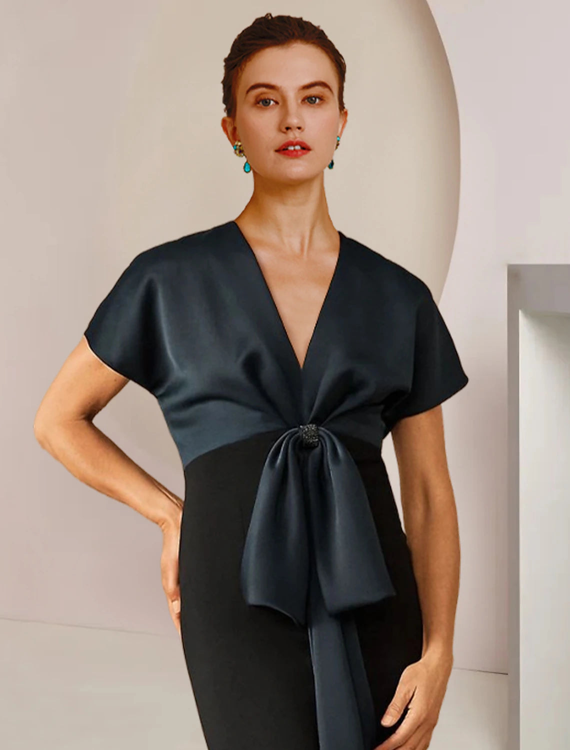 Floor-length satin dress featuring a color block design and bow detail.