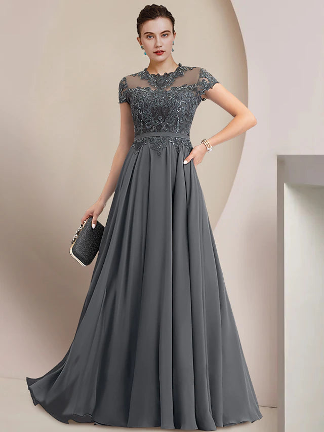Elegant floor-length sheath gown with jewel neck and short sleeves, featuring sequin and lace details.