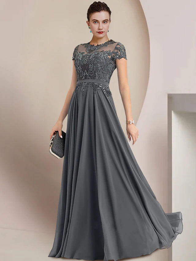 Side view of the chiffon and lace sheath dress, highlighting the pleated design.