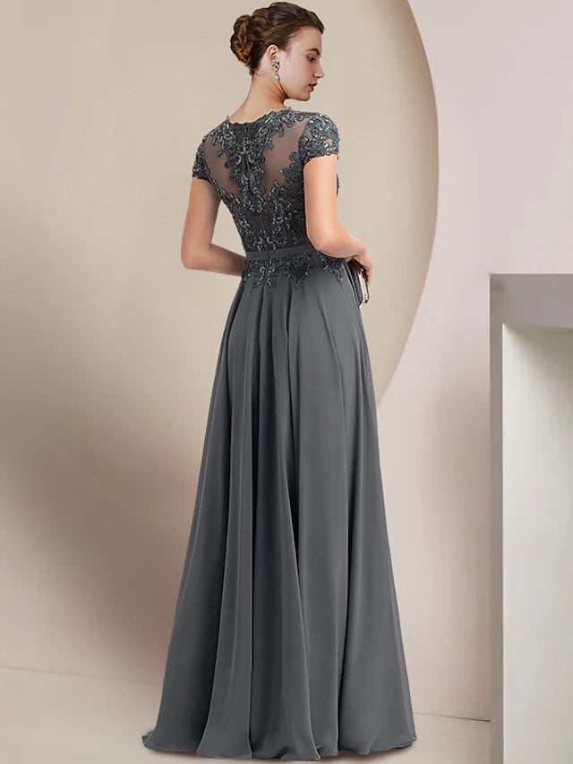 Back view of the elegant floor-length gown, showcasing the sophisticated silhouette.