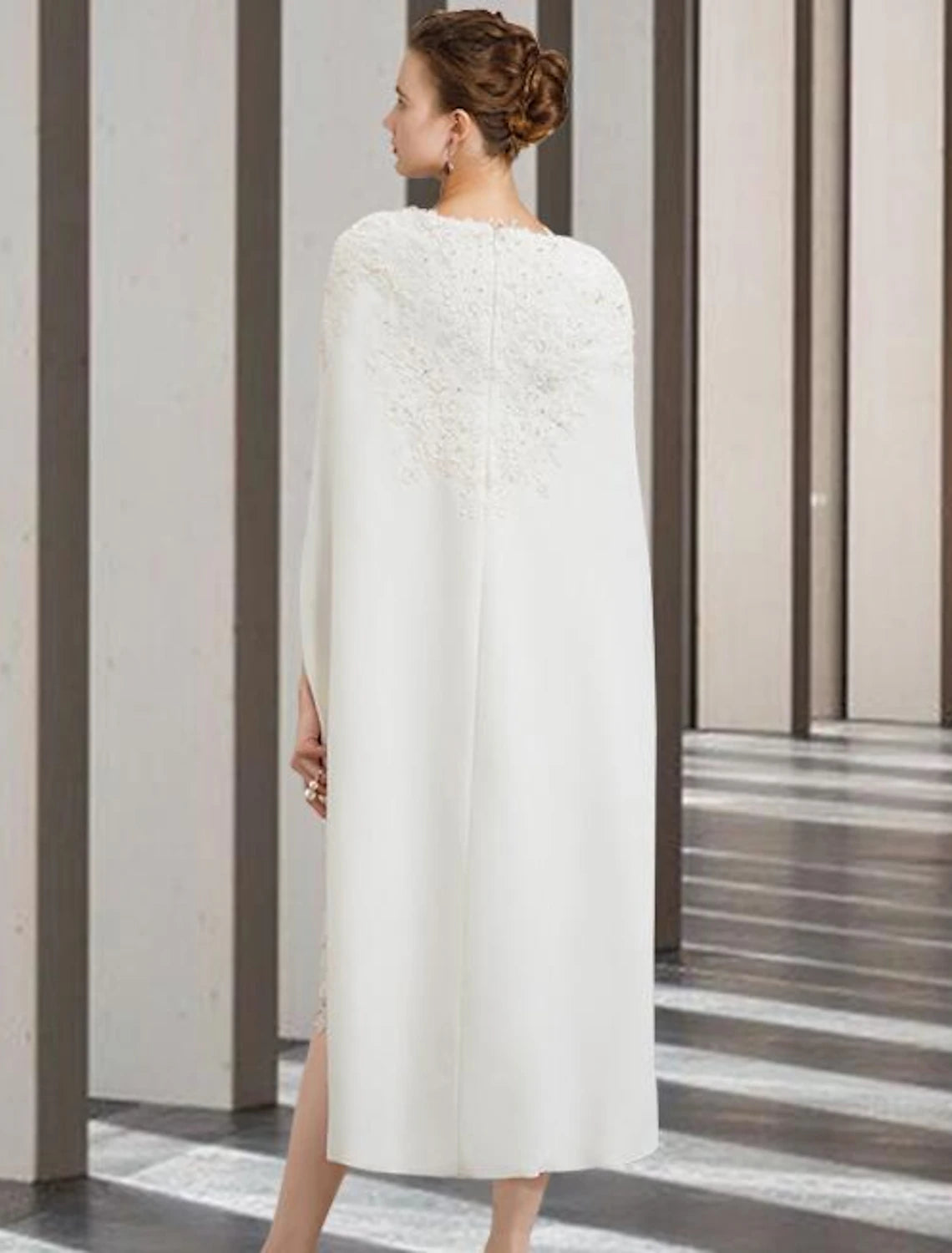 Back view of the elegant two-piece dress showing chiffon and lace details.