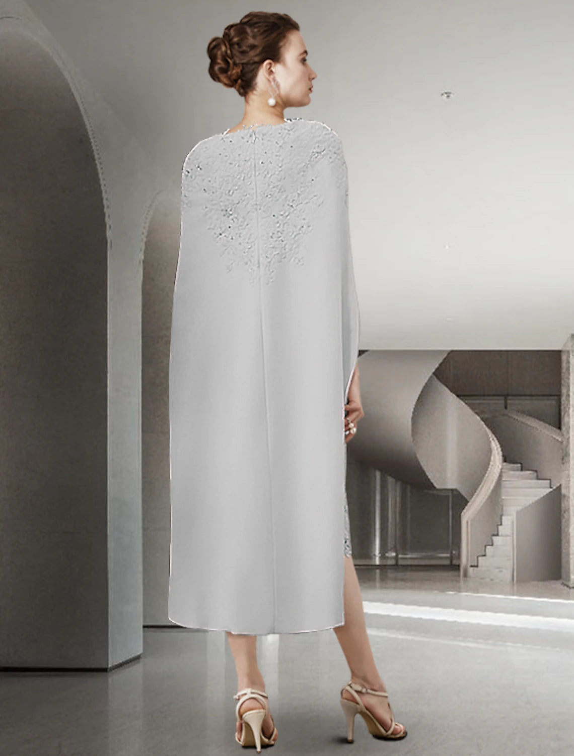Full length view of the knee-length chiffon and lace dress.