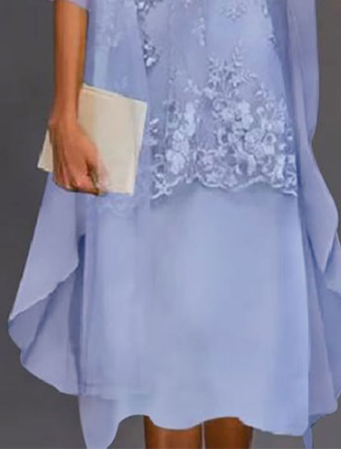 Side view of the sheath mother of the bride dress with chiffon and lace details.