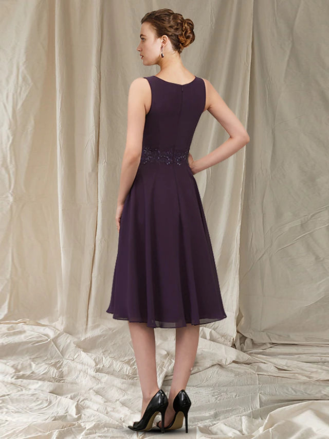 Side view of the elegant sheath dress with appliques.