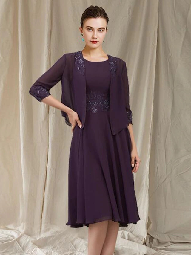 Model wearing the two-piece mother of the bride dress, front view.