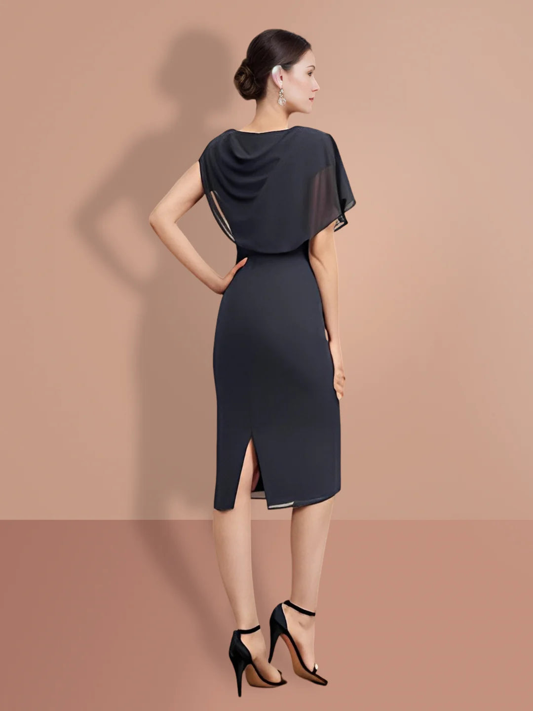 Woman modeling a sophisticated dark knee-length sheath dress with short sleeves.