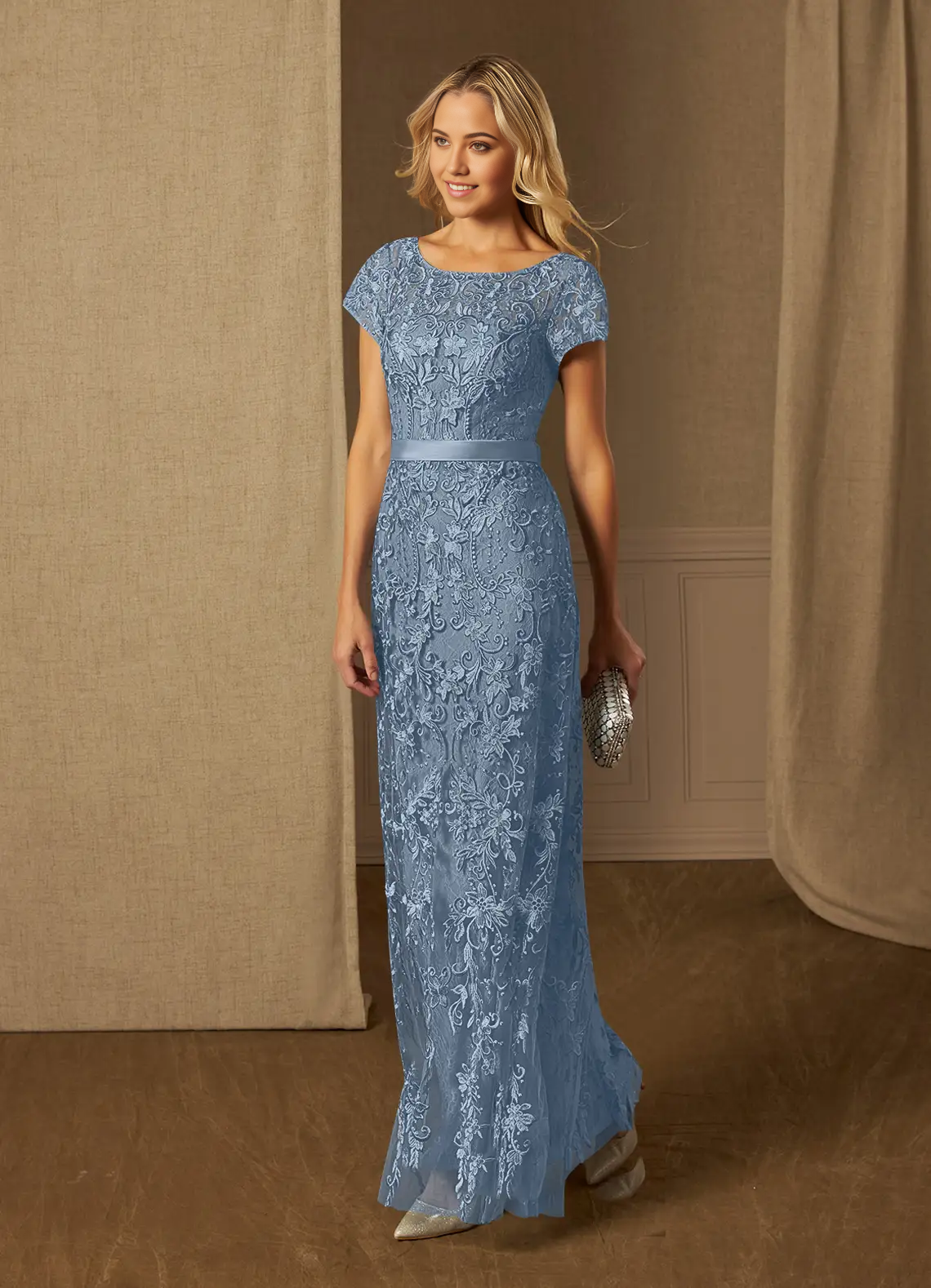 Detail of the short sleeves and scoop neckline on the dusty blue dress.