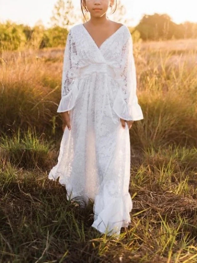 Close-up of the lace detail on the bodice of the ivory flower girl dress.