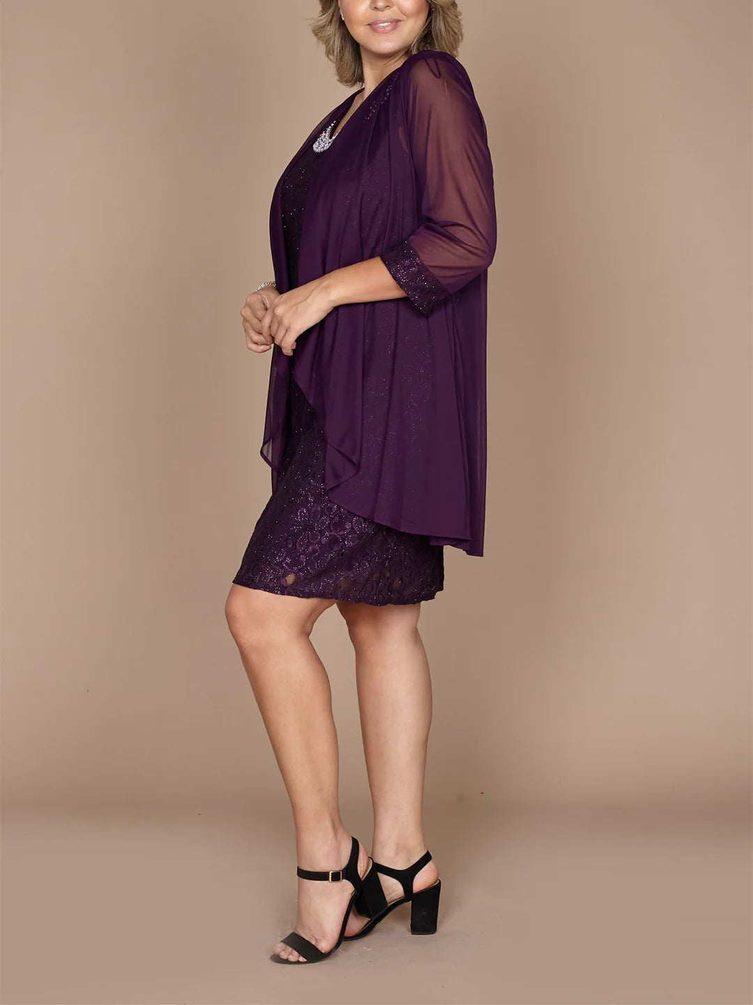 Side profile of the elegant short sleeve sheath dress.