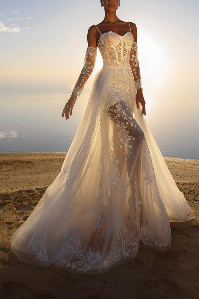 Back view of the sheath wedding dress with intricate lace details.
