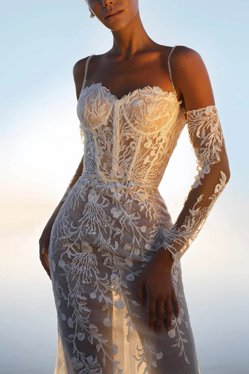 Full length view of the sleeveless lace bridal gown.