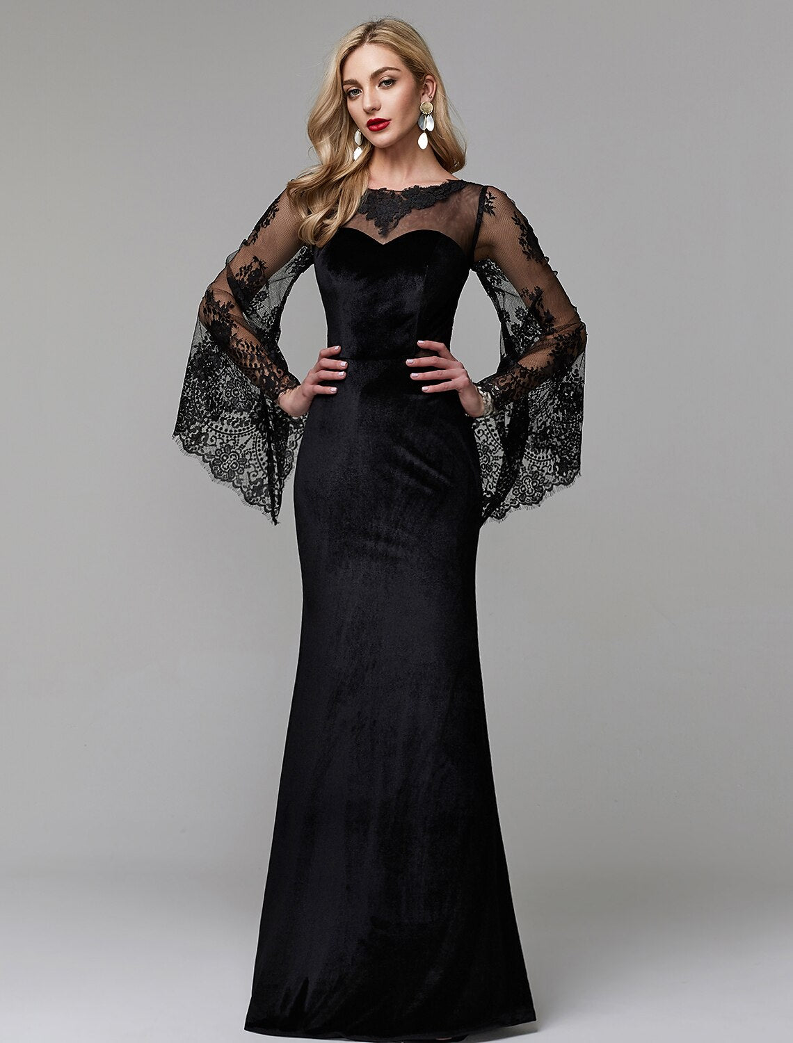 Elegant sheath lace dress with long sleeves and illusion neckline.