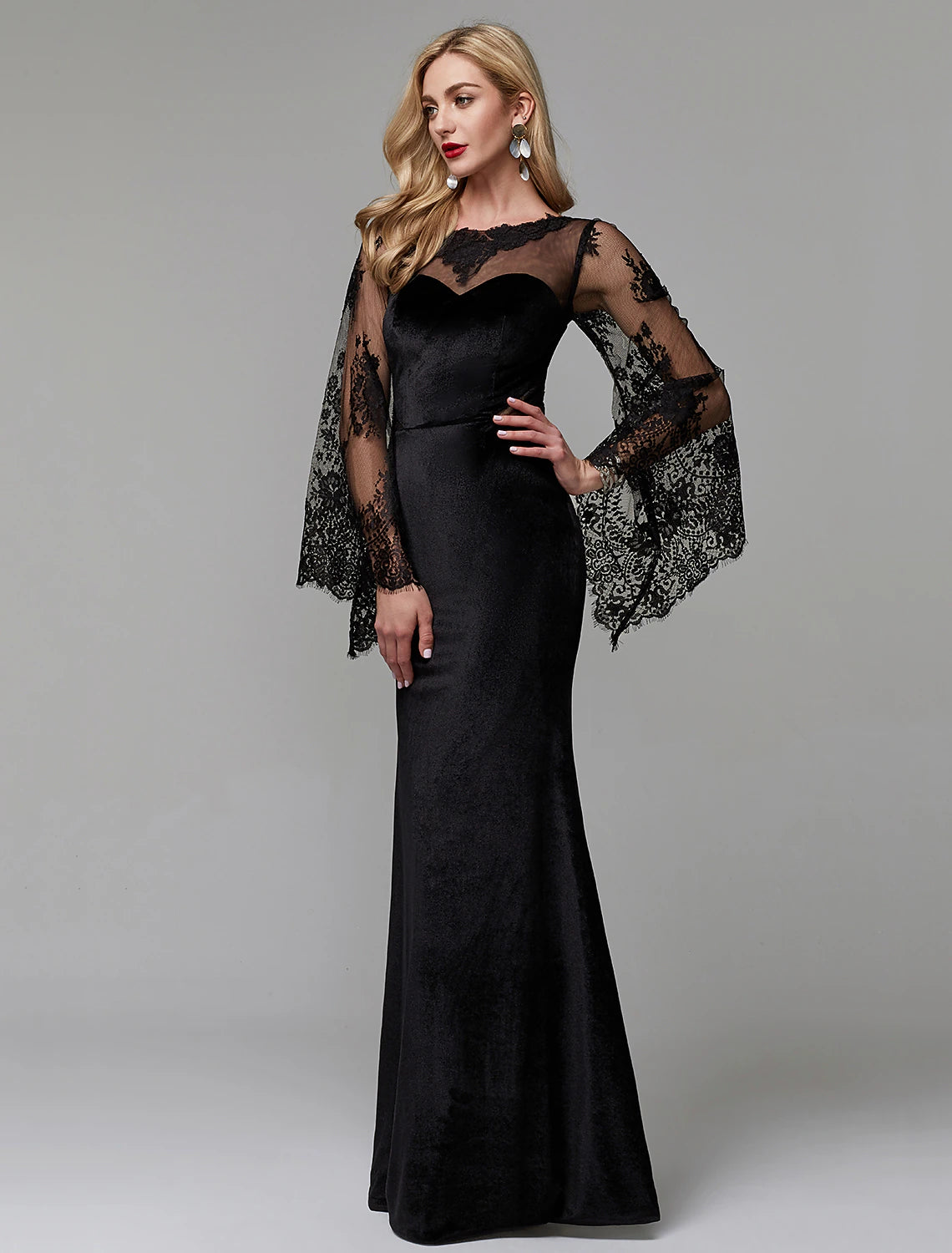 Back view of a floor-length lace gown, suitable for formal occasions.