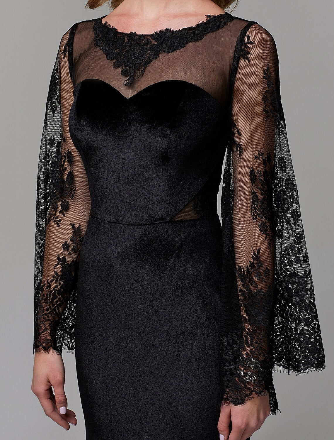 Close-up of the intricate lace detail on the illusion neck dress.