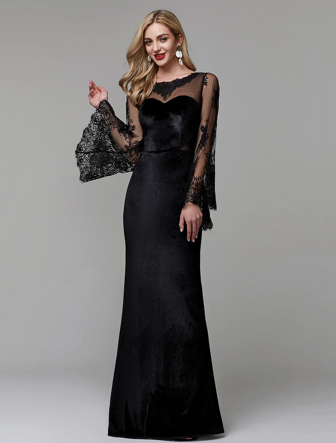 Detailed view of the long lace sleeves and fitted bodice of the gown.