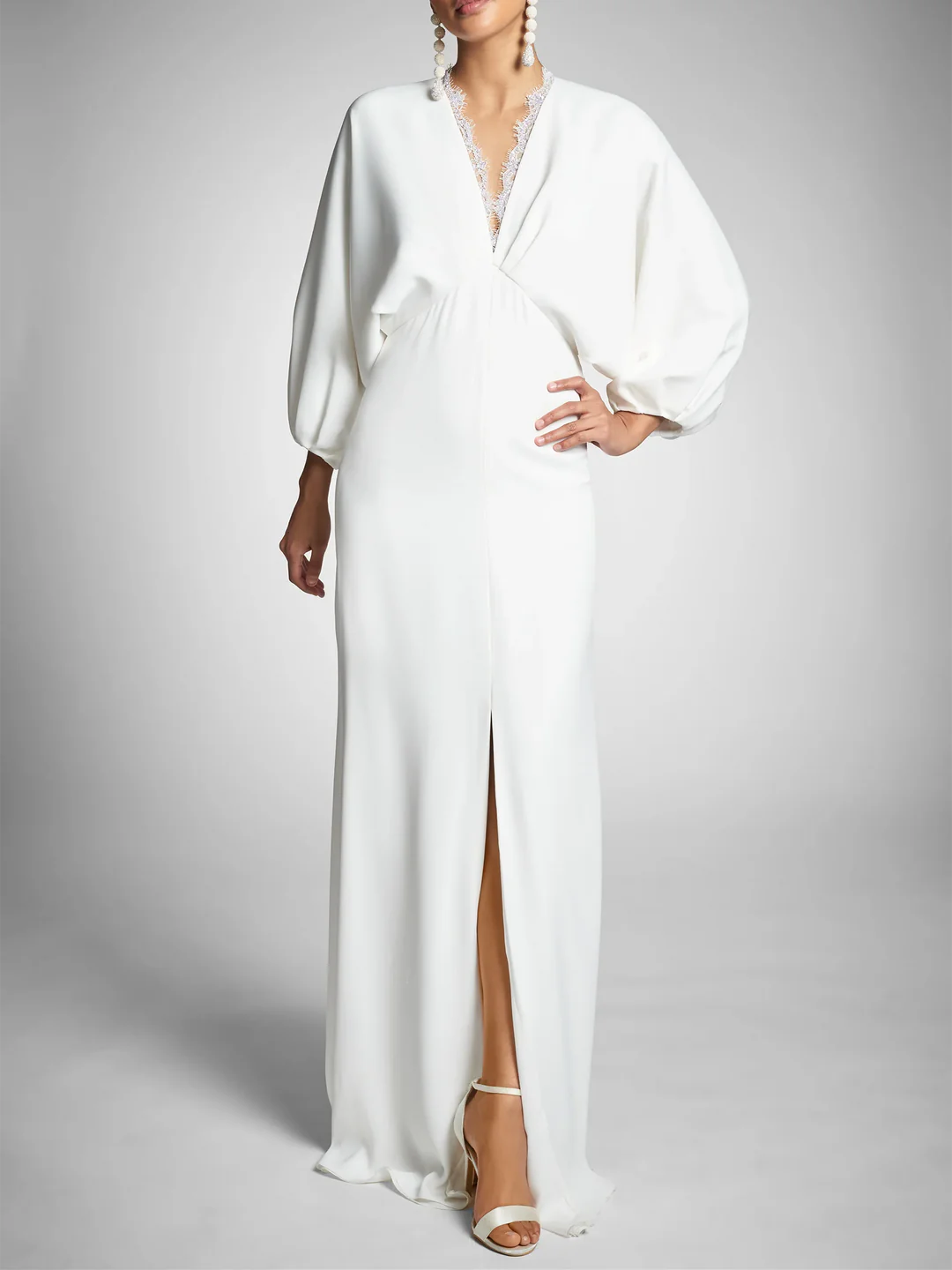 Elegant sheath long sleeve V-neck wedding dress.