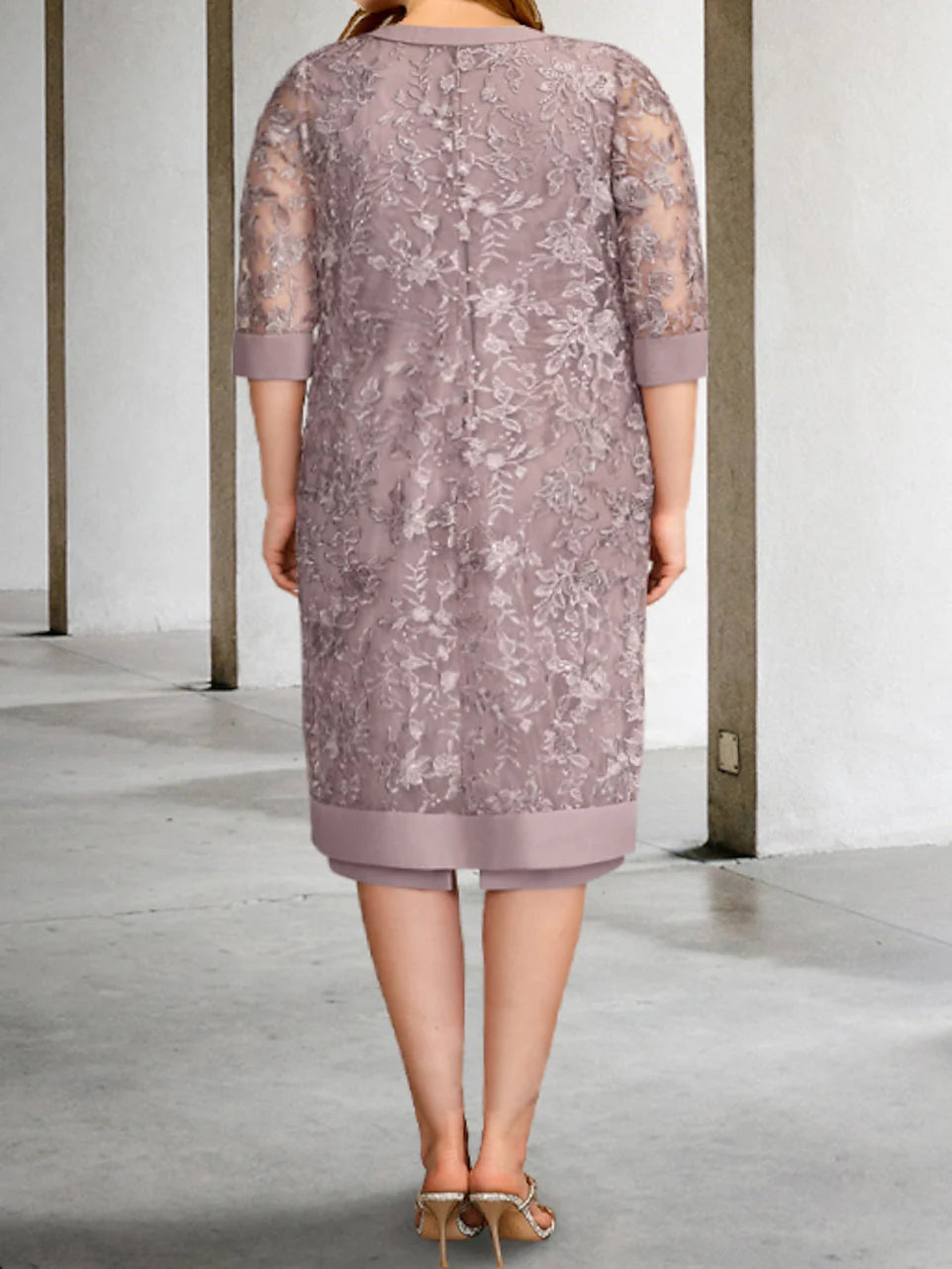 Side view of a woman in a sophisticated ankle-length Mother of the Bride gown.