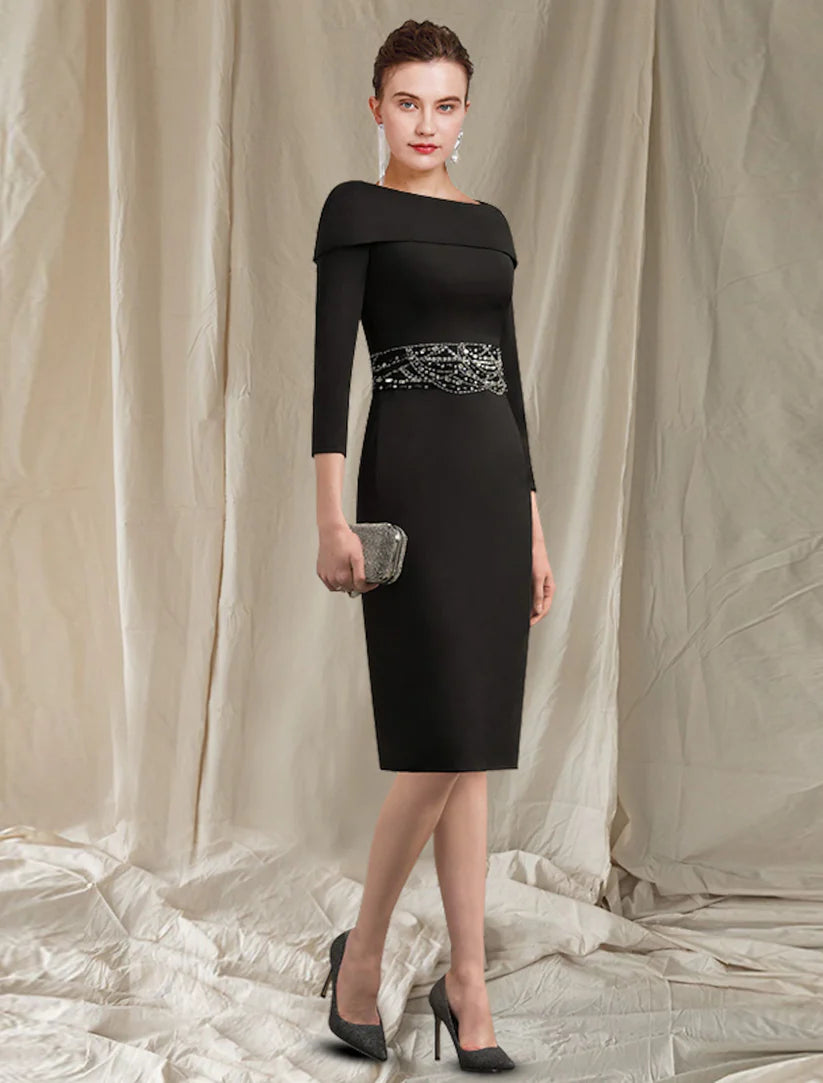 Woman wearing an elegant knee-length sheath dress with 3/4 sleeves and beading.
