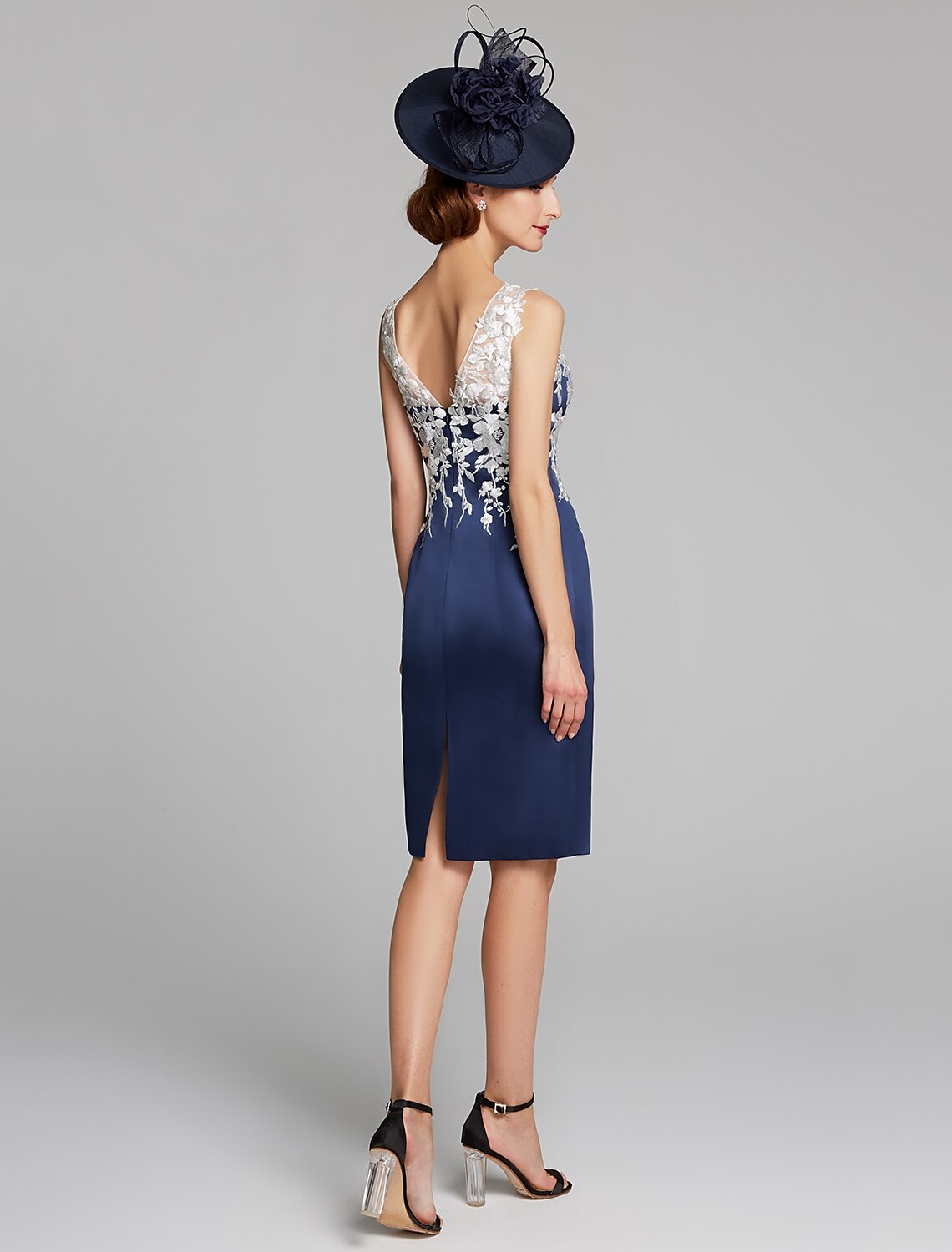Full length view of the sleeveless sheath dress.