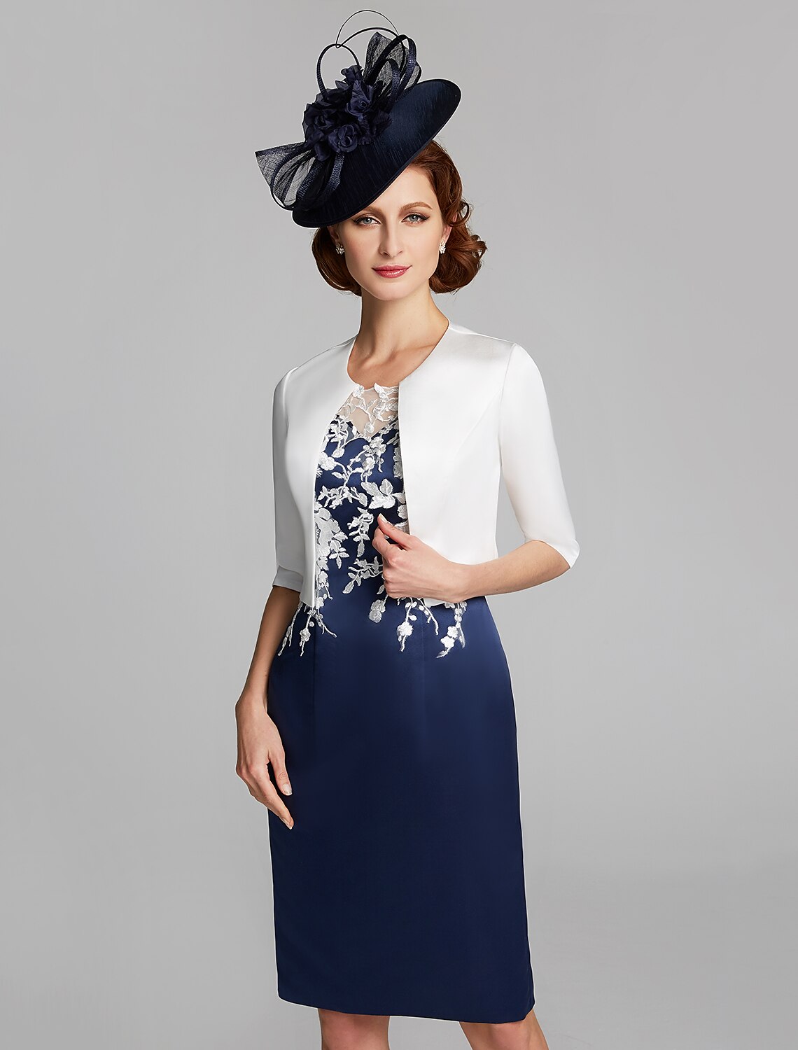 Detailed view of the jewel neckline and bodice of the dress.