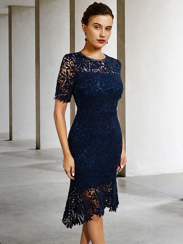 Back view of the elegant sheath dress, highlighting the solid color and appliques.