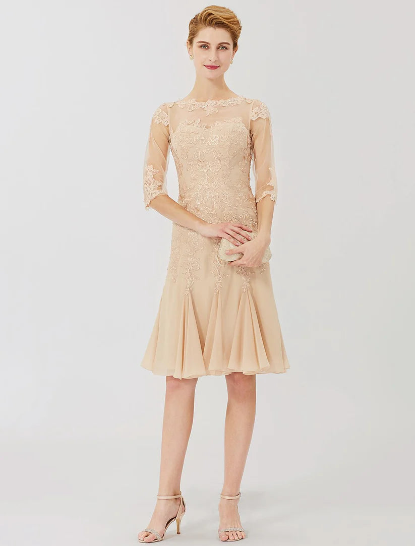 Woman wearing an elegant knee-length sheath Mother of the Bride dress with lace and half sleeves.