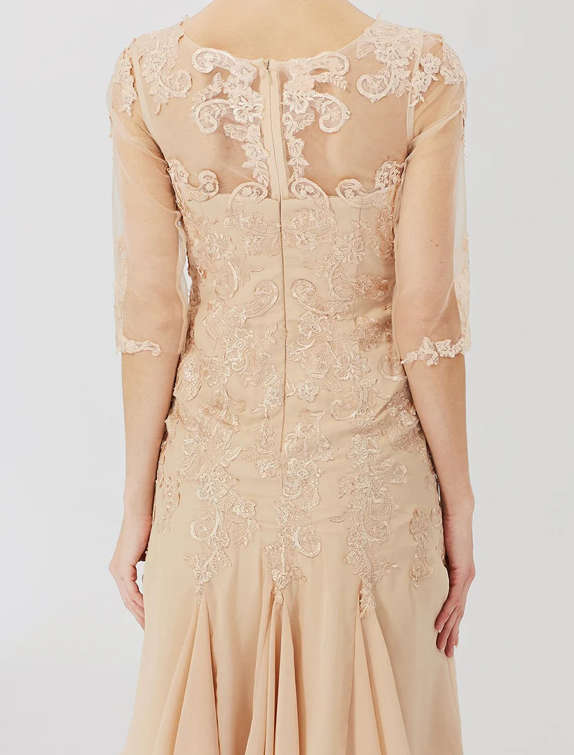 Full view of the elegant sheath dress, highlighting its knee-length and half-sleeve design.