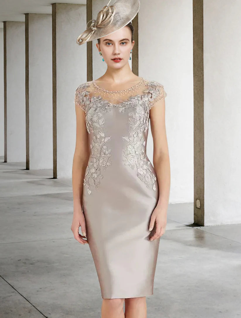 Elegant Mother of the Bride sheath dress with jewel neck, cap sleeves, and lace details.