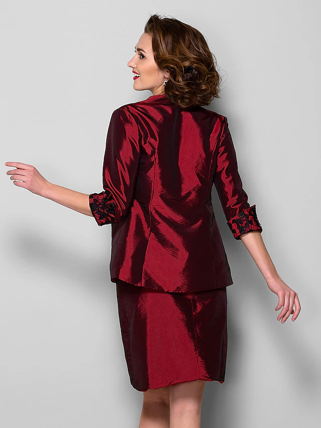 Full length view of the elegant sheath dress.