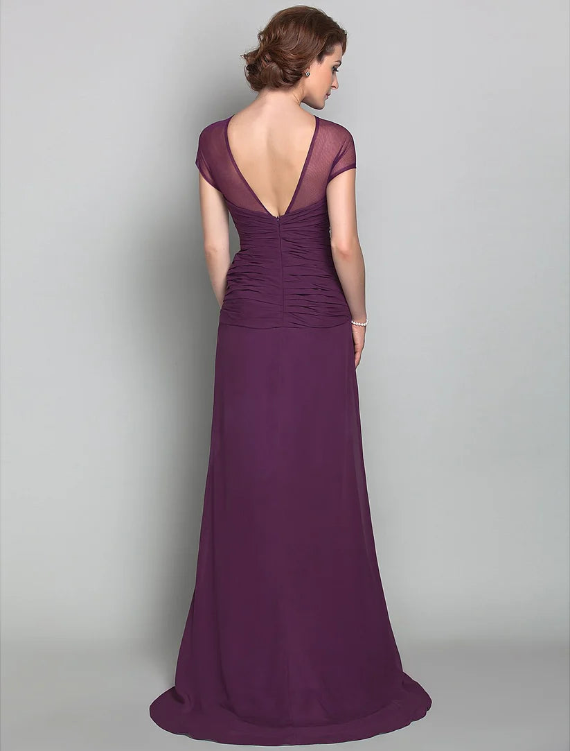 Side view of the sheath Mother of the Bride dress showing side draping and sweep train.