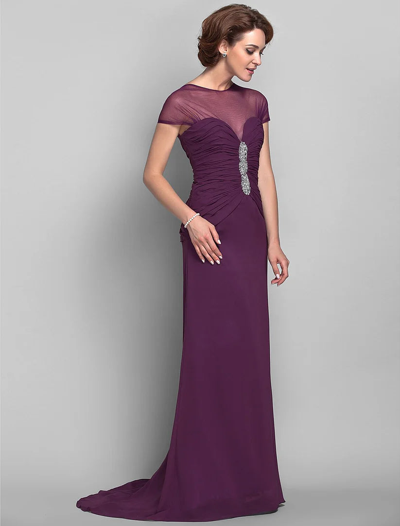 Front view of the formal dress, emphasizing the jewel neckline and beaded details.