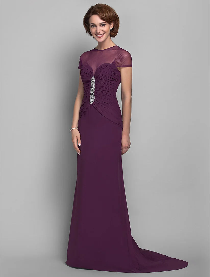 Side profile of the elegant sheath dress, showing the fabric flow and design.