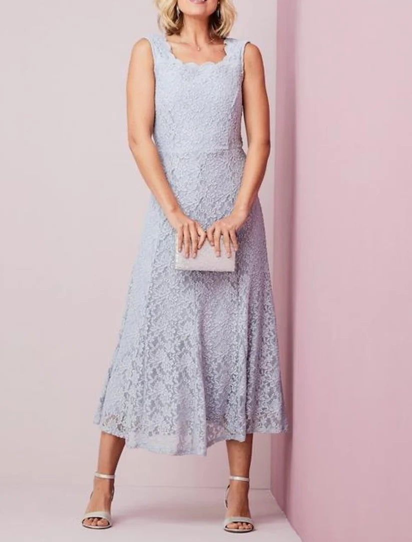 Back view of the ankle-length sheath mother of the bride dress, showing lace pleats and applique details.