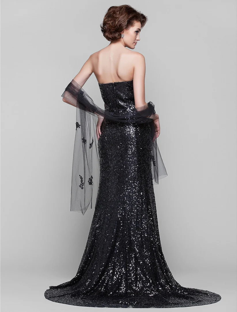 Back view of a sequined sheath dress with a sweep train.