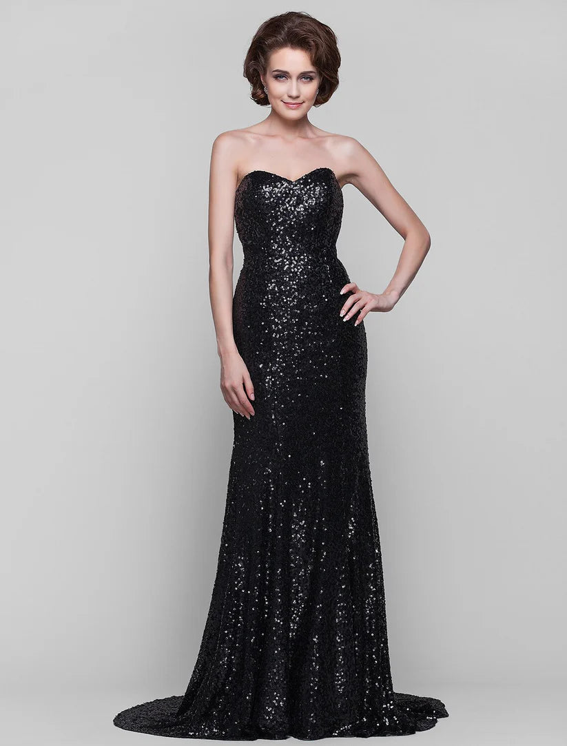 Side profile of a strapless sequined formal dress.