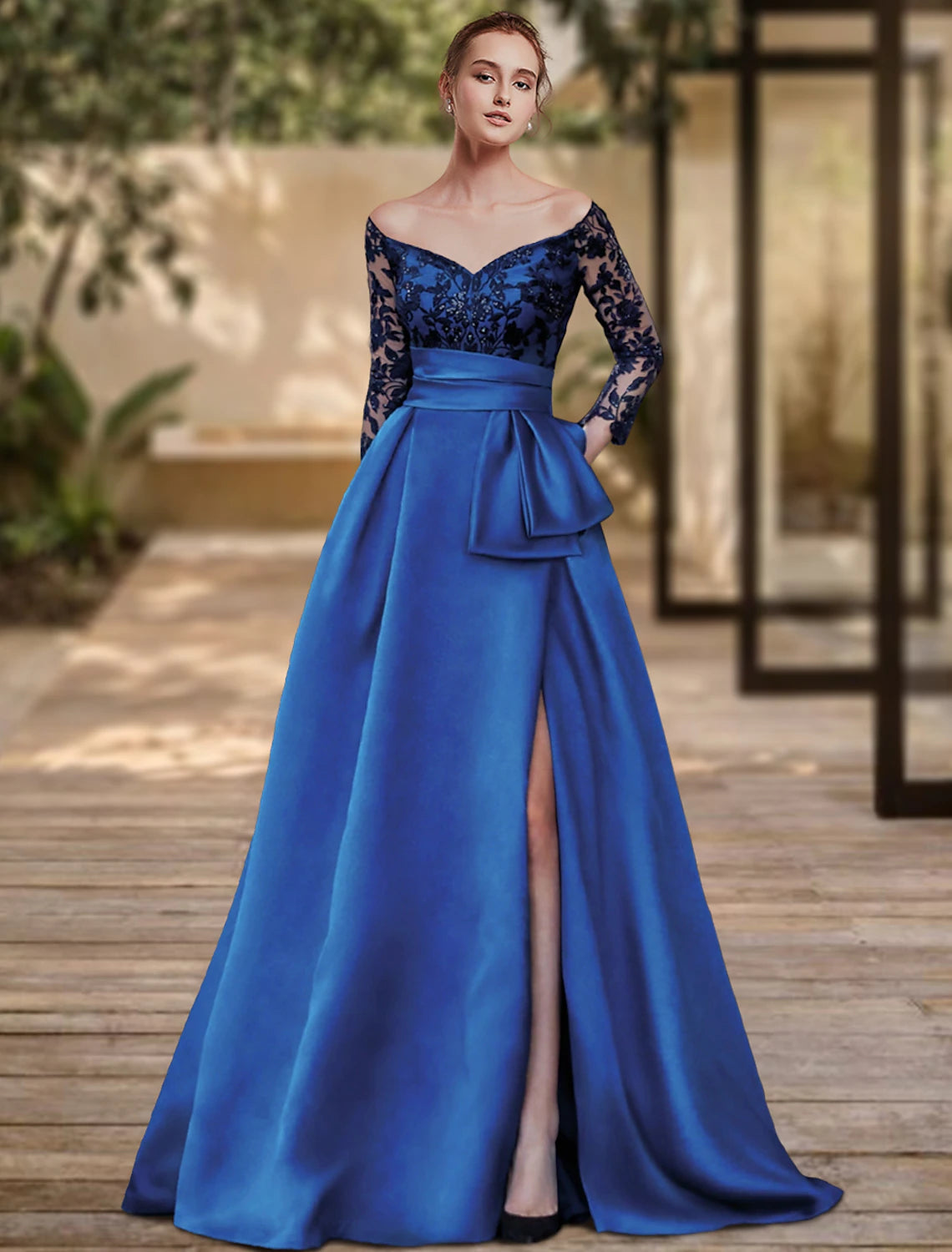 Model wearing an elegant off-shoulder sheath evening gown with a high split and sequins.