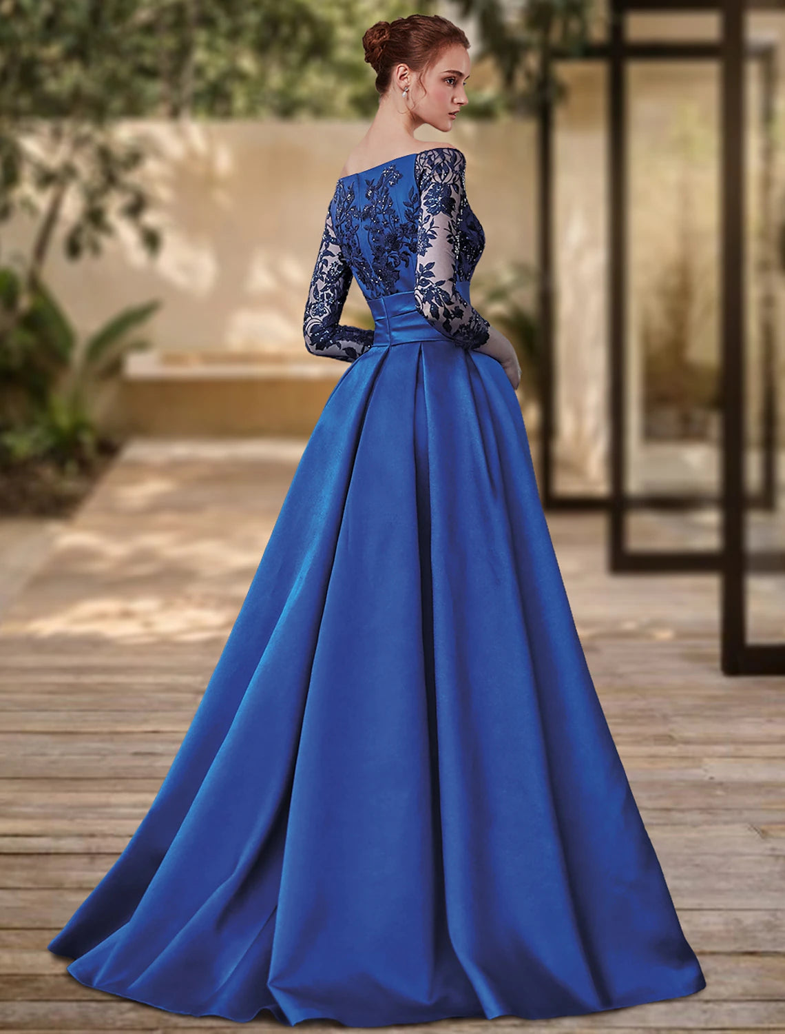 Full length view of the formal off-shoulder dress with a sweep train.