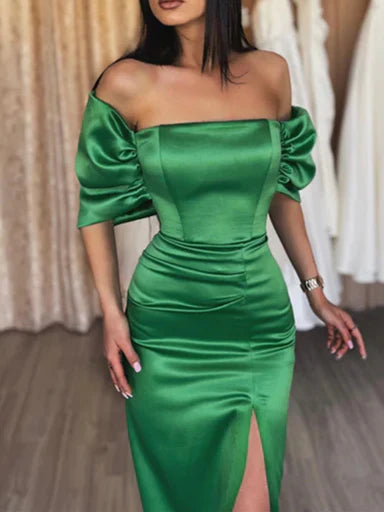 Close-up of the off-shoulder neckline and sheath silhouette of a formal dress.