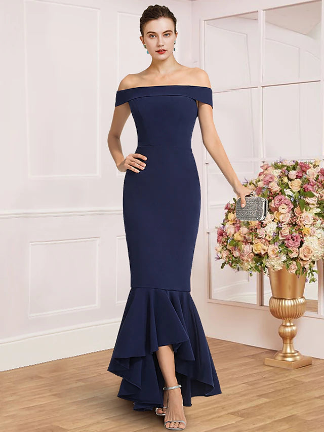 Elegant off-shoulder sheath dress with cap sleeves and pleats.