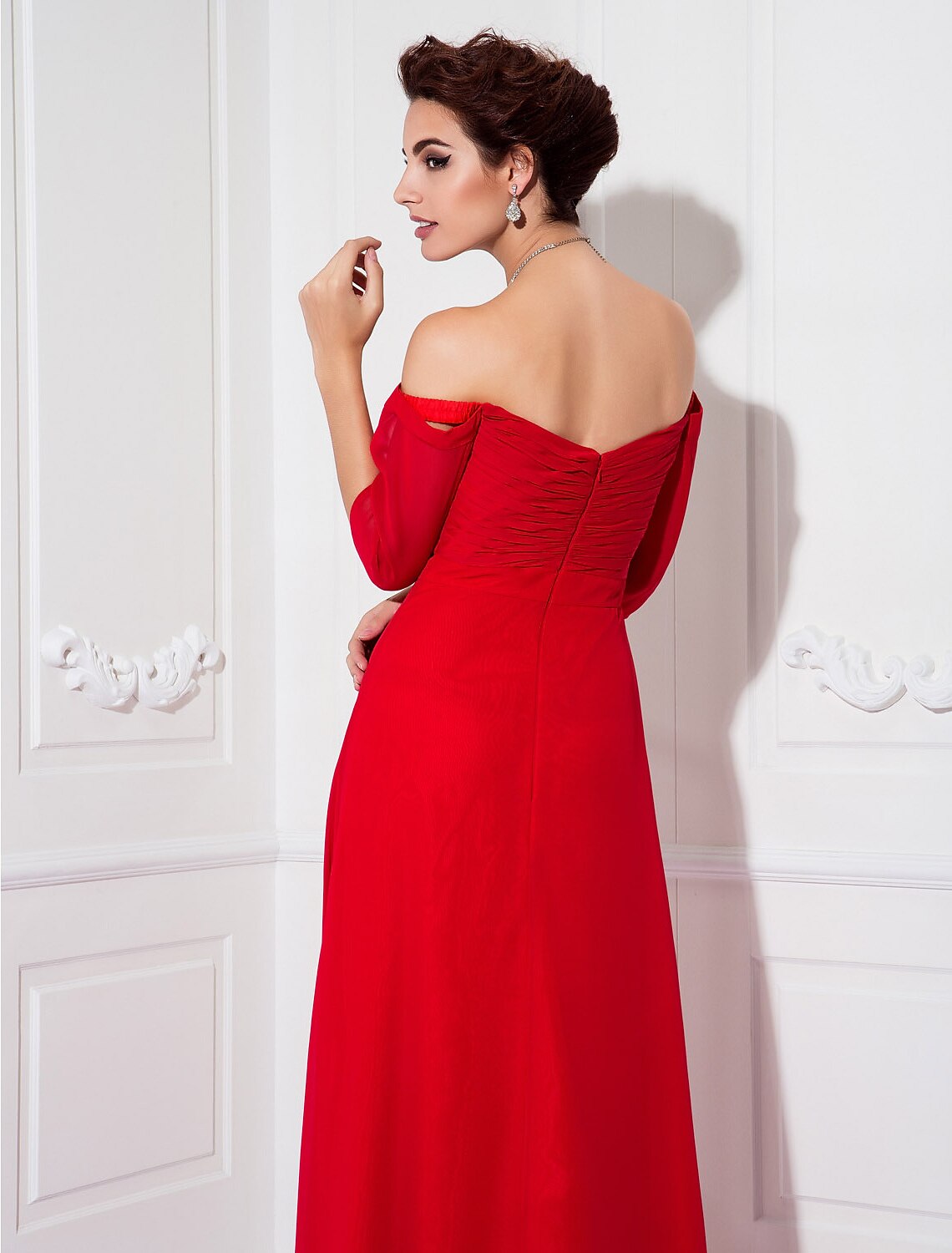 Detail of the half sleeve and off-shoulder design on the chiffon dress.