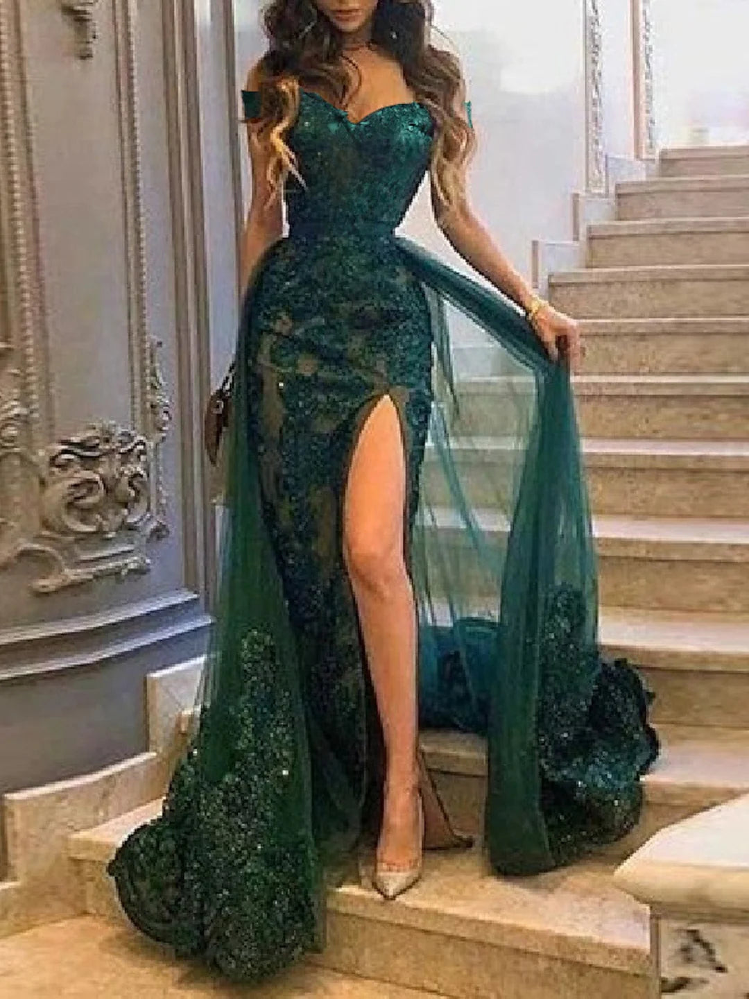 Elegant off-shoulder sheath prom dress with intricate applique details.