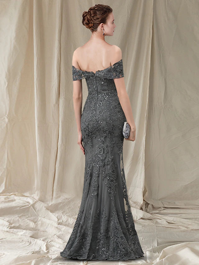 Back view of a floor-length sheath gown for Mother of the Bride, featuring pleats and appliques.