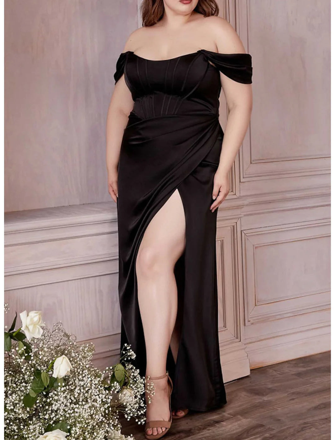 Off-shoulder formal gown with sheath silhouette, side view.