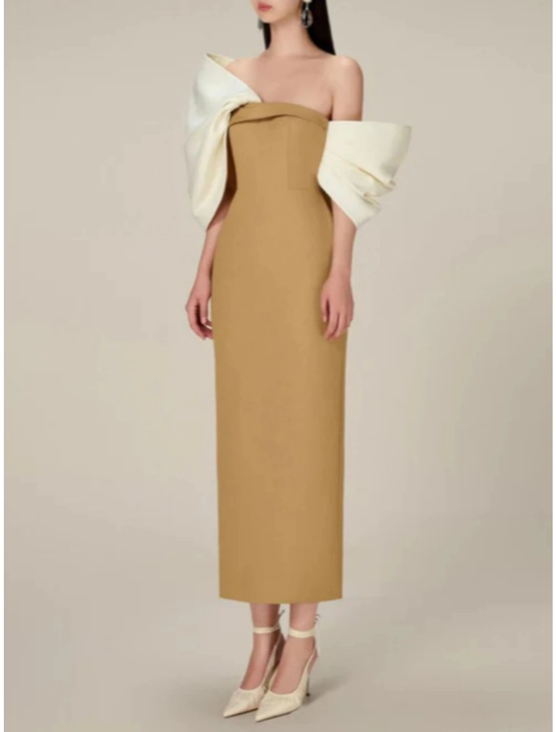 Detail of the off-shoulder neckline and half sleeve on the satin formal dress.