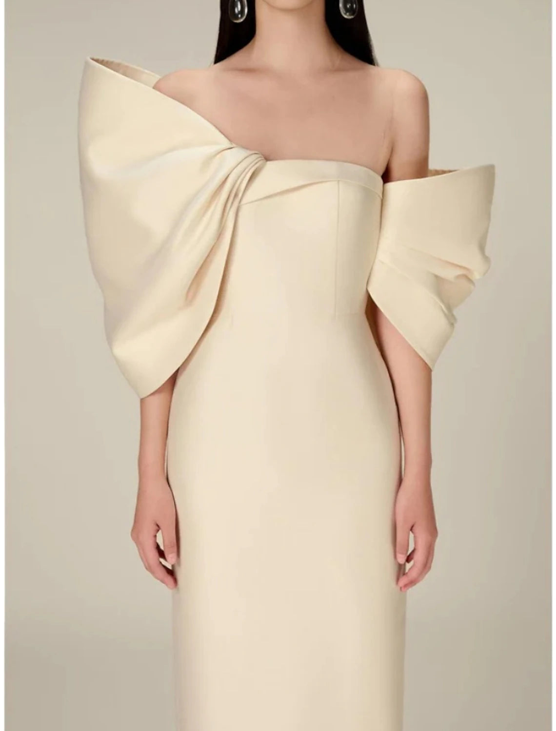 Back detail of the off-shoulder tea length dress, emphasizing the satin texture.