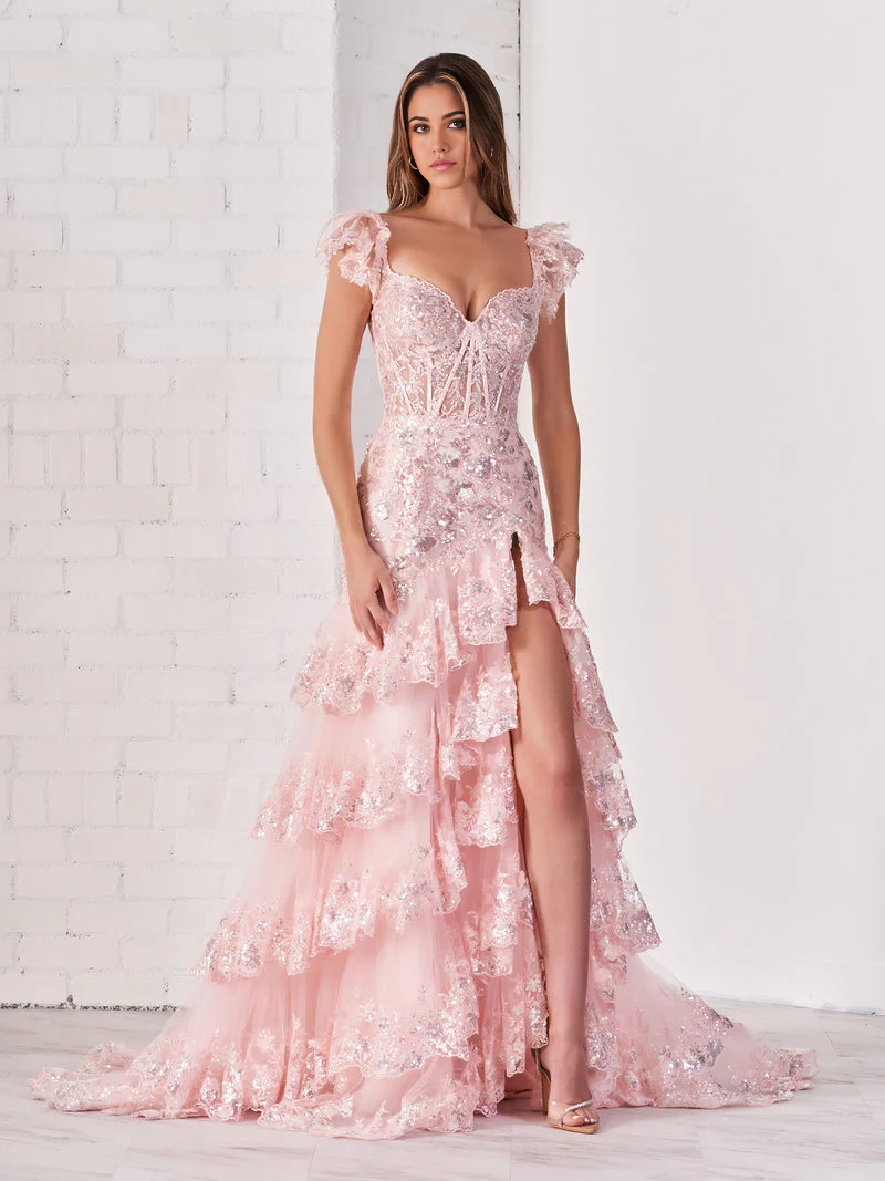 Woman wearing an elegant long off-shoulder sheath dress with a lace-up back.